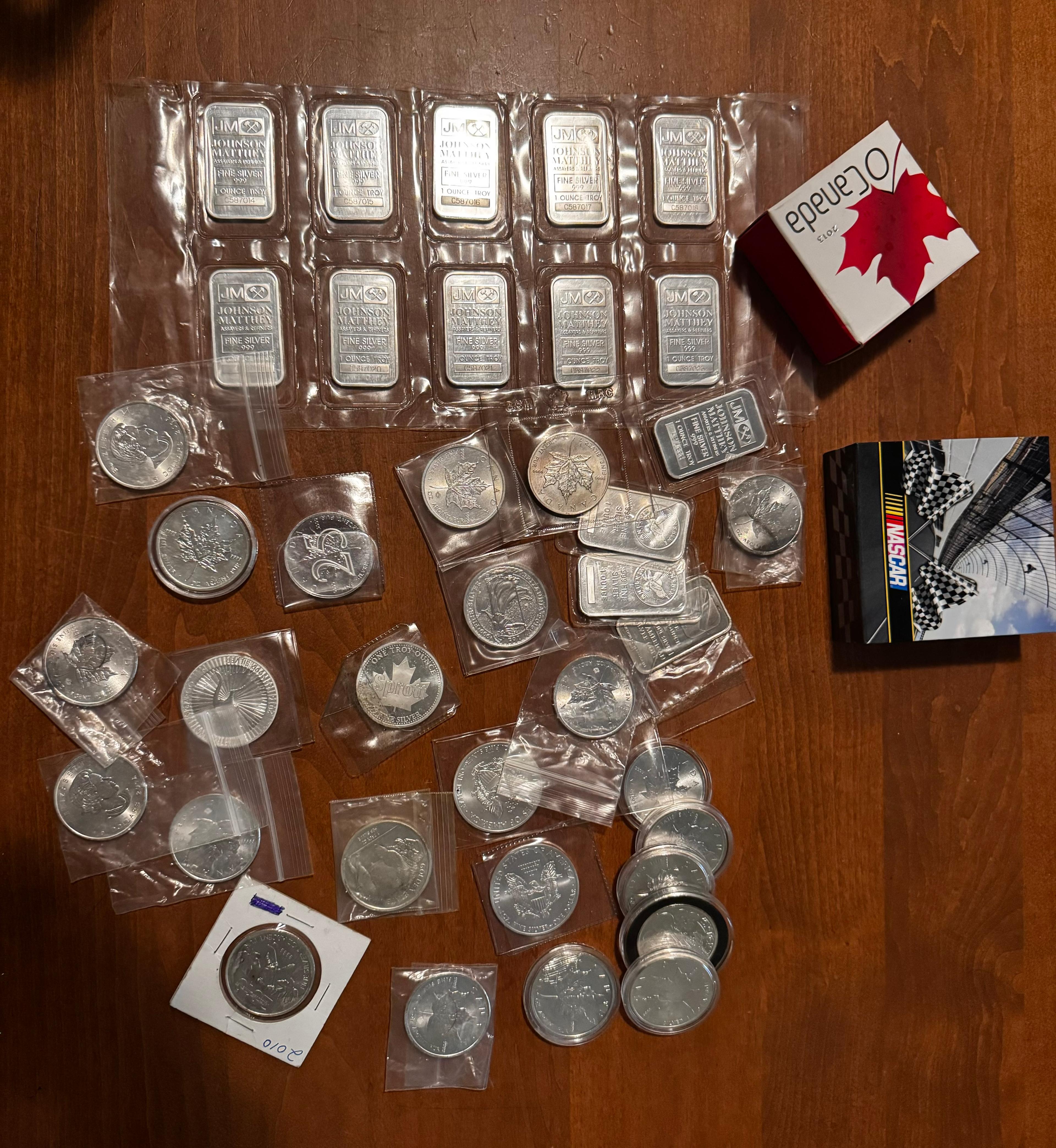 Photo of Silver coins and bars