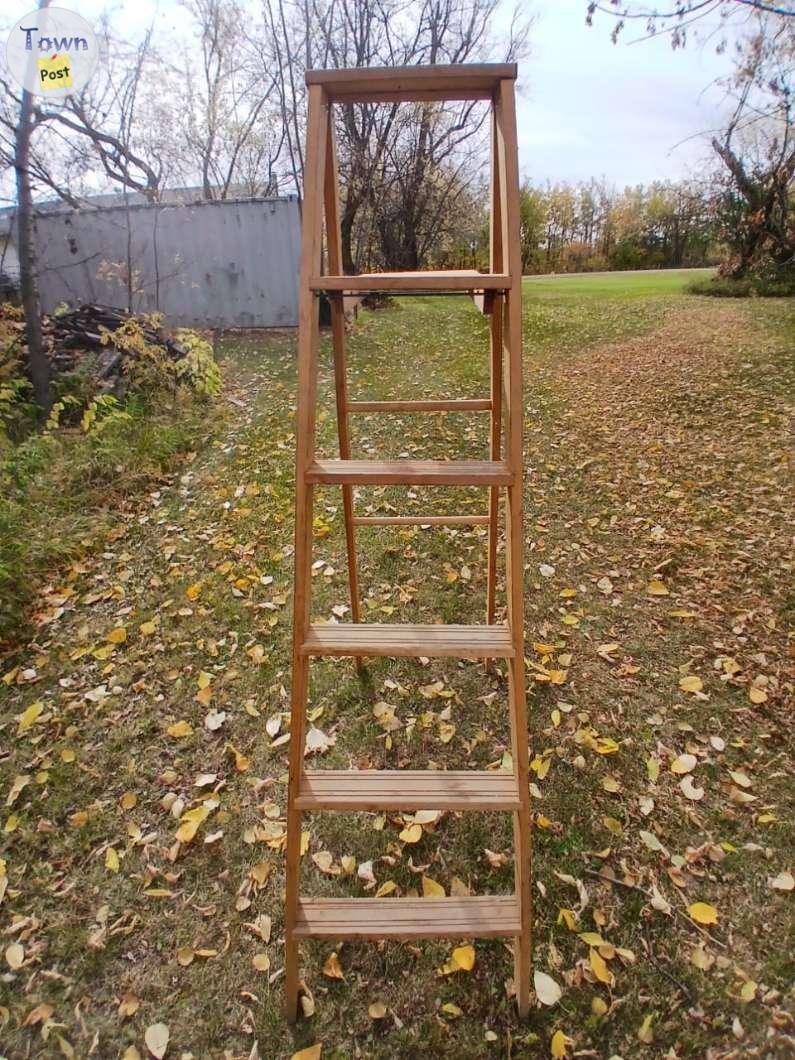 Photo of 4 step wooden ladder